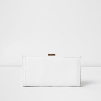 White metallic panel foldover clip top purse